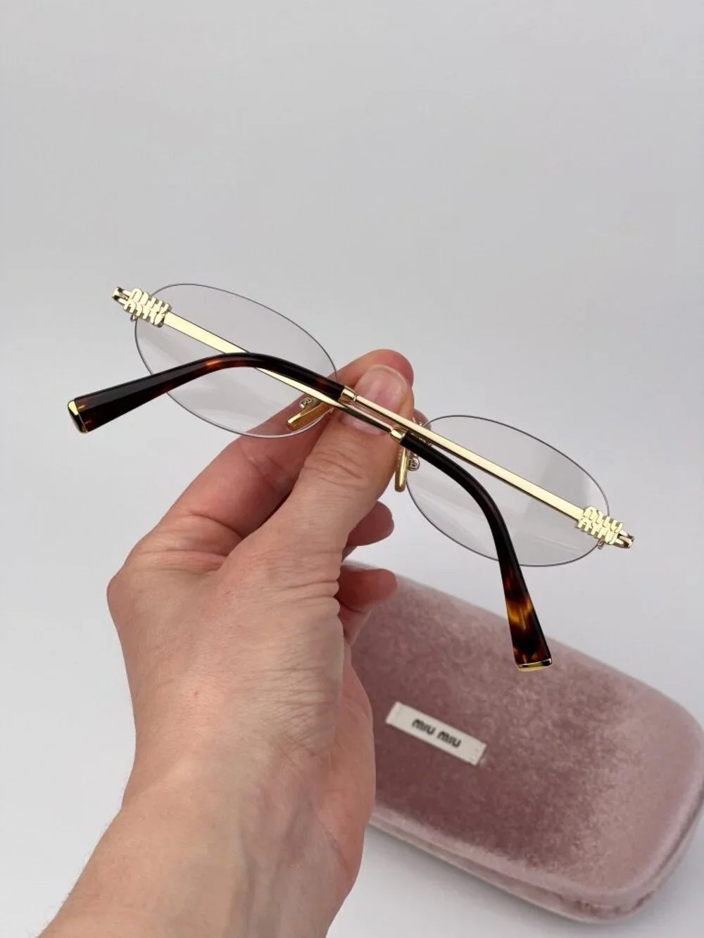 Miu Miu Women’s Eyeglasses – MUA54S 5AK08N | Gold Oval Rimless